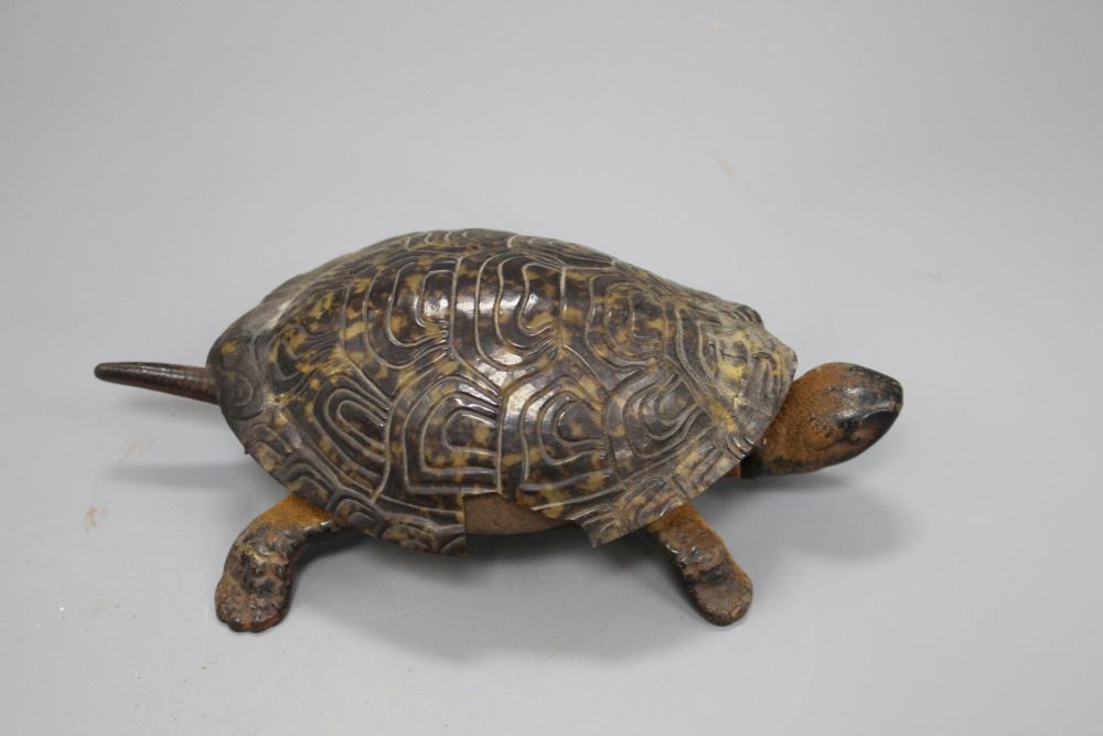 A Victorian cast iron and simulated tortoiseshell table bell, modelled as a tortoise, length 17cm